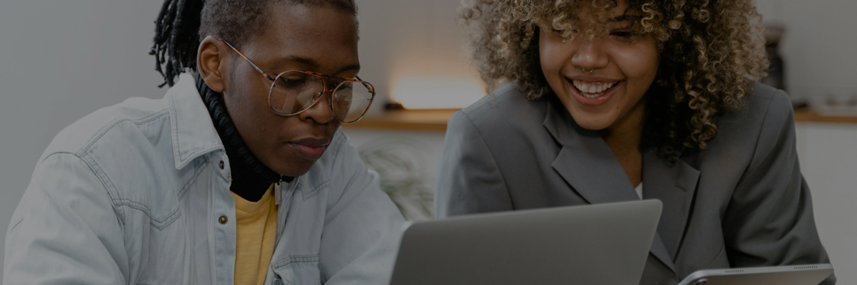 Two Black people working on a technological project