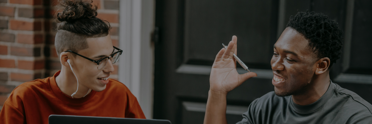 Two people working on a computer