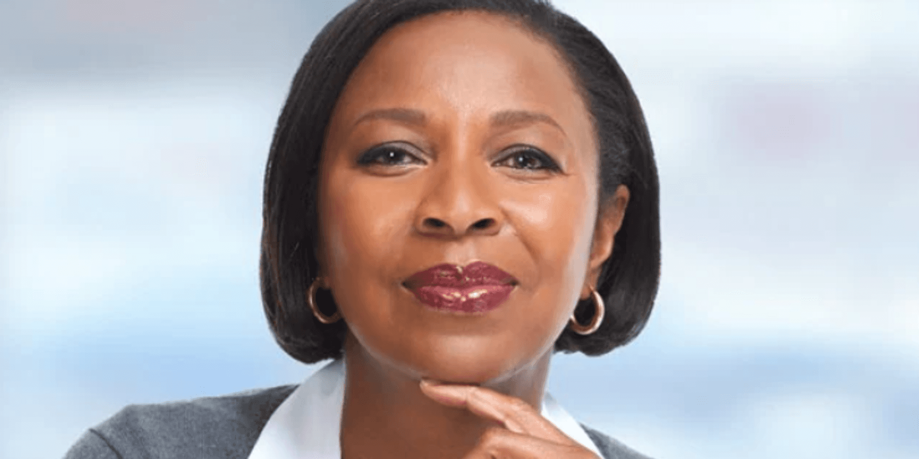 A black woman looking directly at us