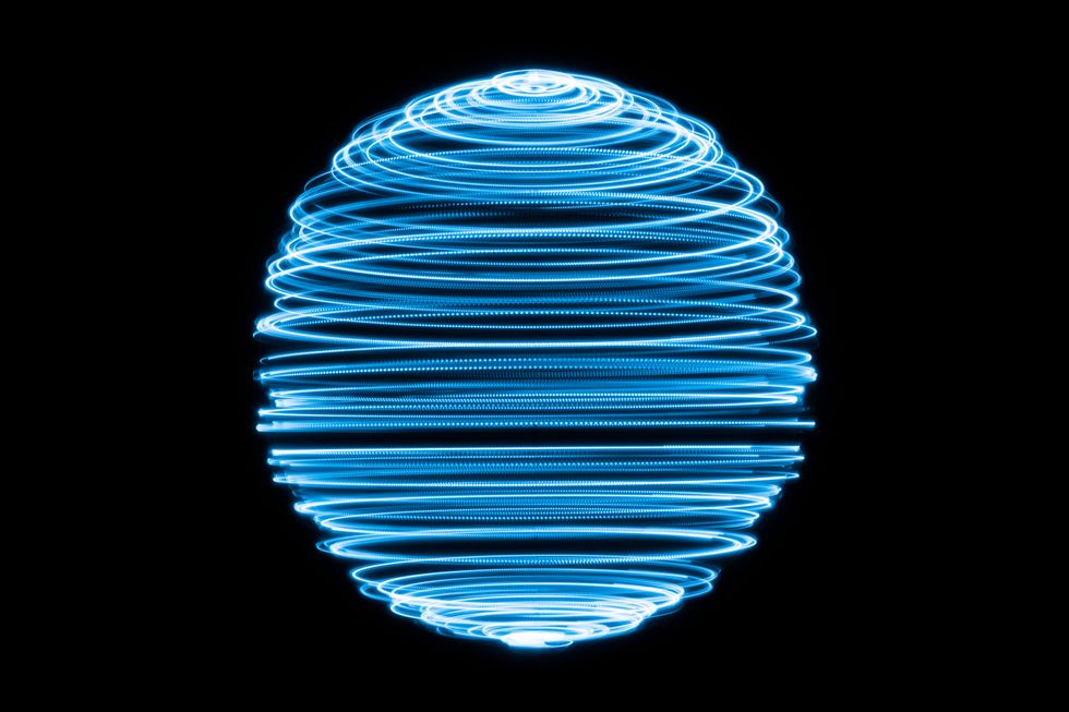 A graphic image of a ball made up of arious electric blue lines on a black background