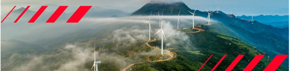 A mountain top with wind turbines
