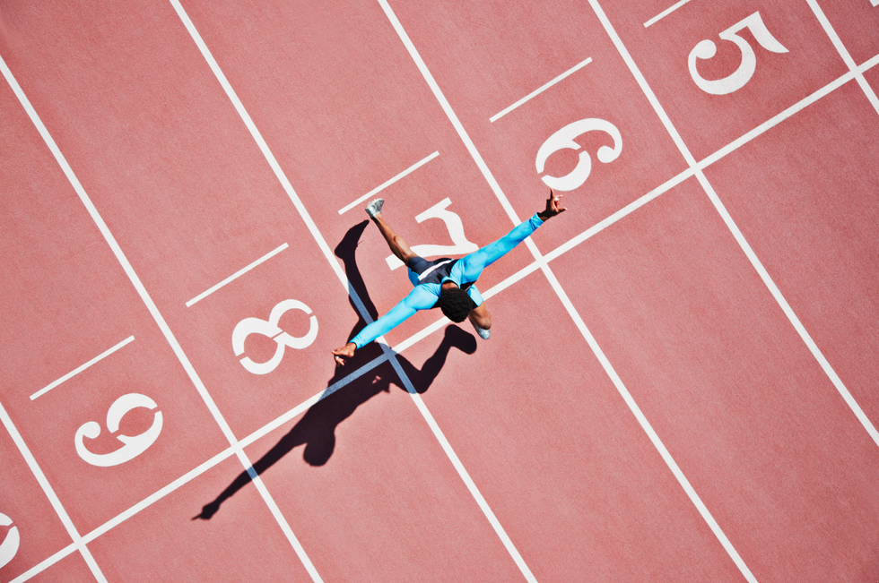 A photo of someone crossing a finish line on a track