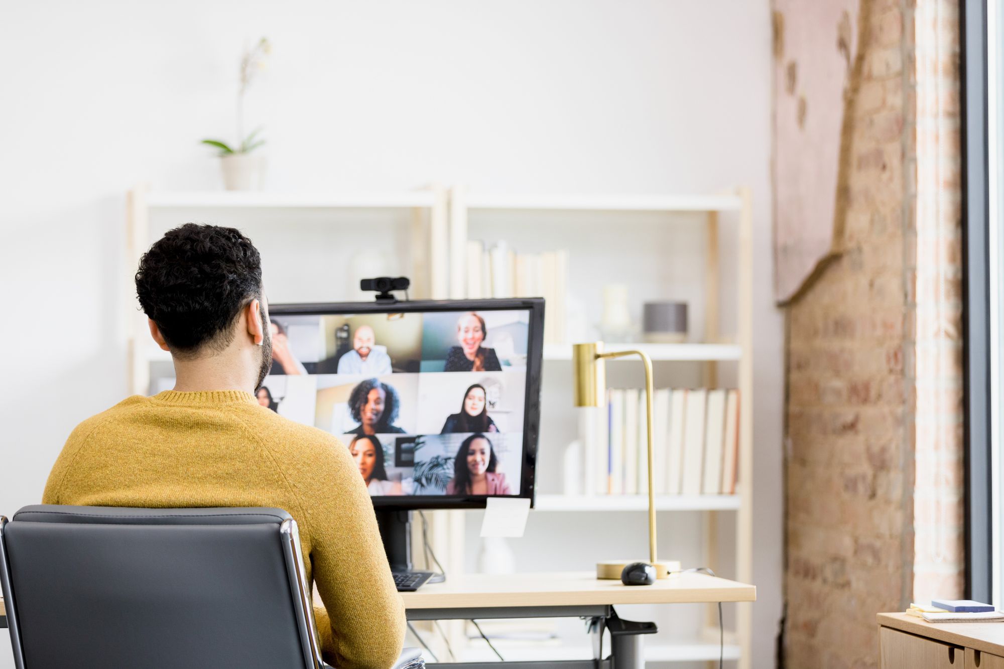 Employee in a virtual call in their office