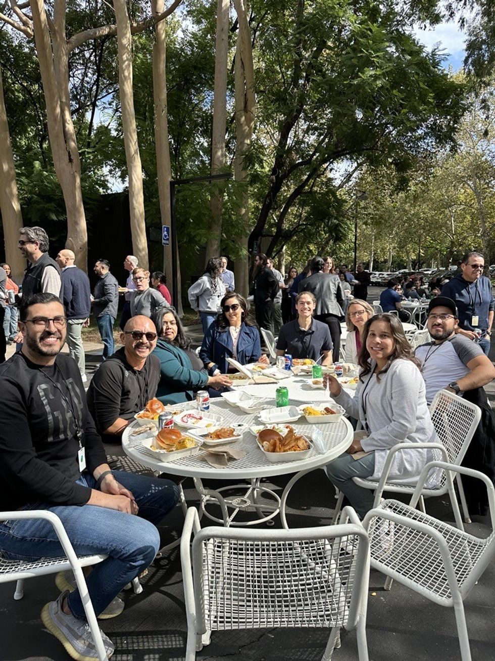 Group of Esri employees enjoying a meal together