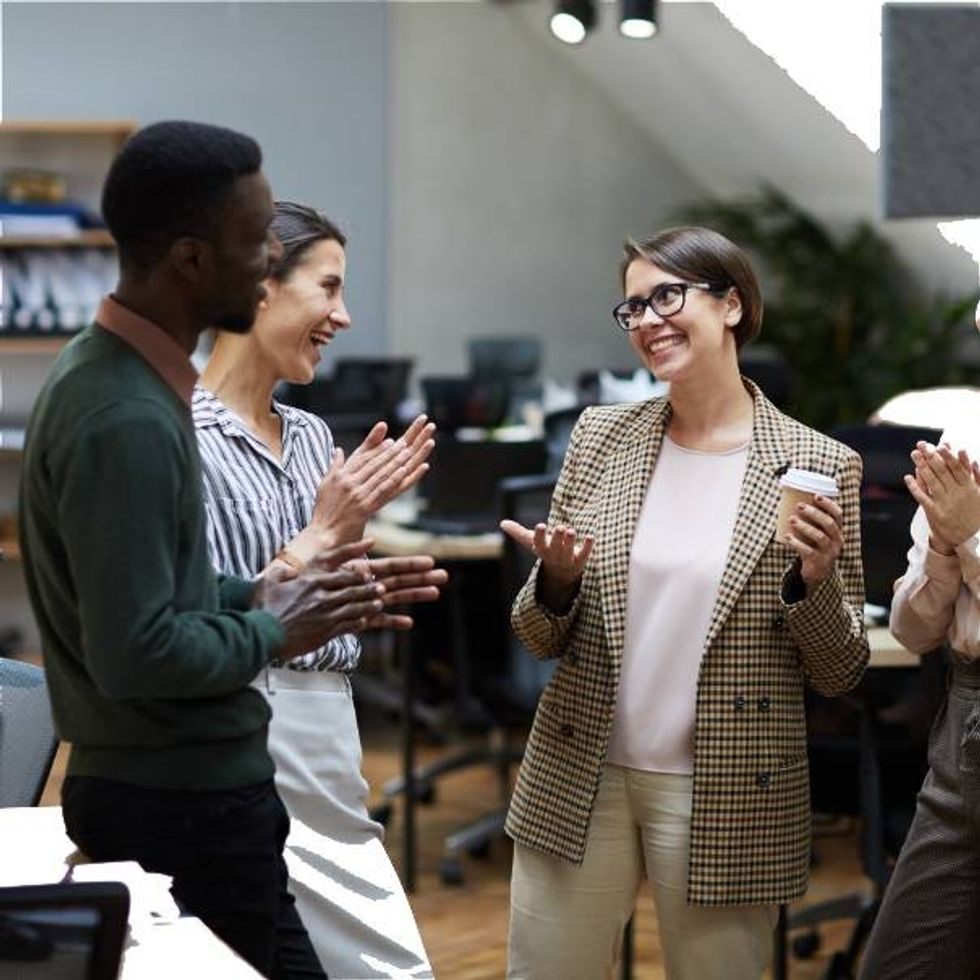 Group of people discussing career growth.