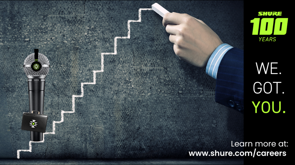 Hand drawing an upward staircase with chalk with the text: Shure 100 years. We. Got. You.