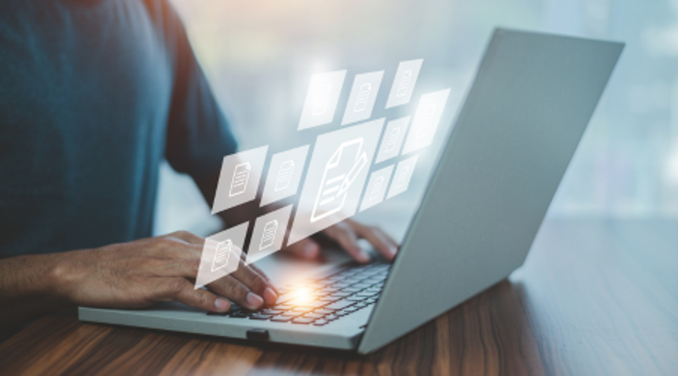 Man in front of a computer working.