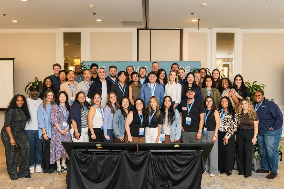 Match Group employees gather for a group photo at a company event.
