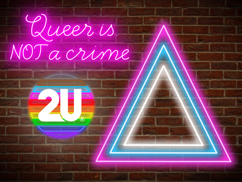 Neon sign that says "Queer is not a crime" and a glowing, rainbow 2U decal on a brick wall 
