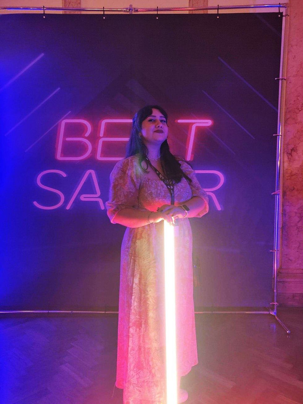 Photo of Alessia G., a 3D environment artist on the Beat Games team, at a Beat Saber event.