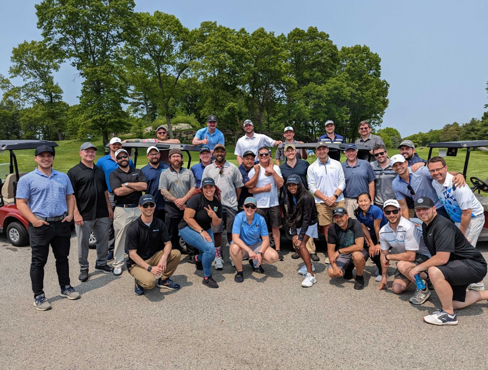 Photo of people at a golf outing