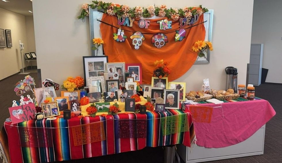 Photo of two tables in an office decorated for Day of the Dead