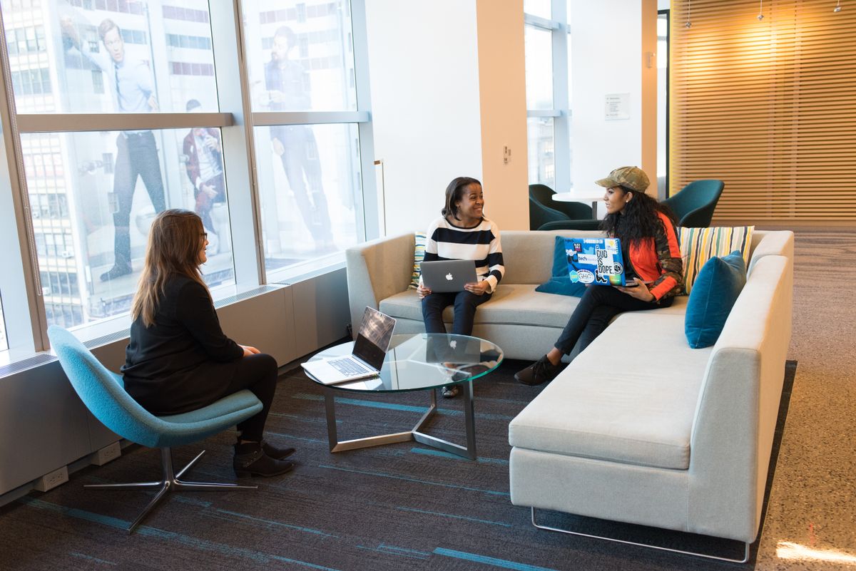 Three people in an office working together