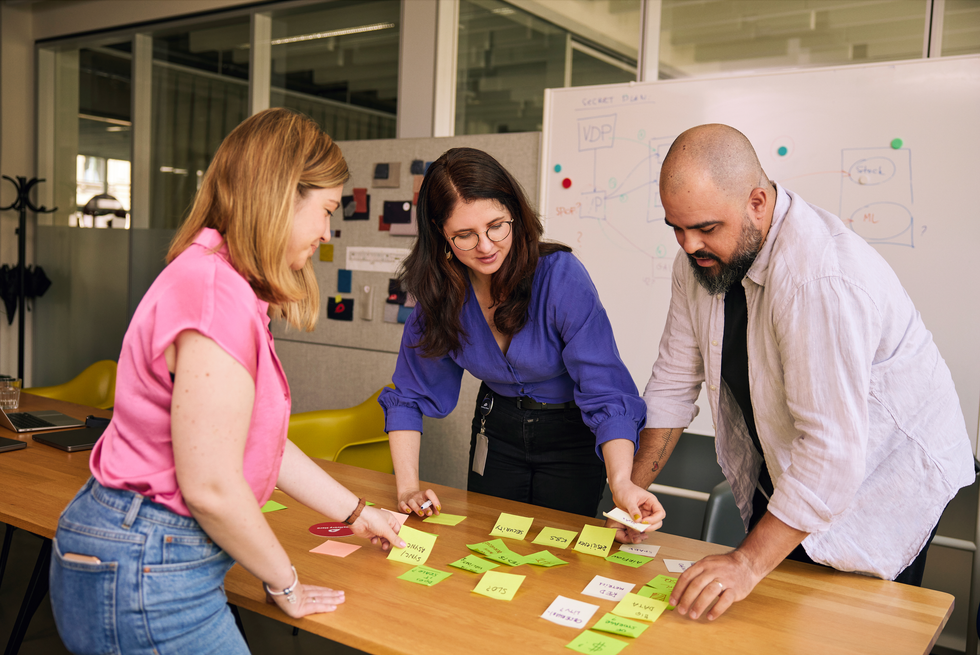 Three team members collaborating