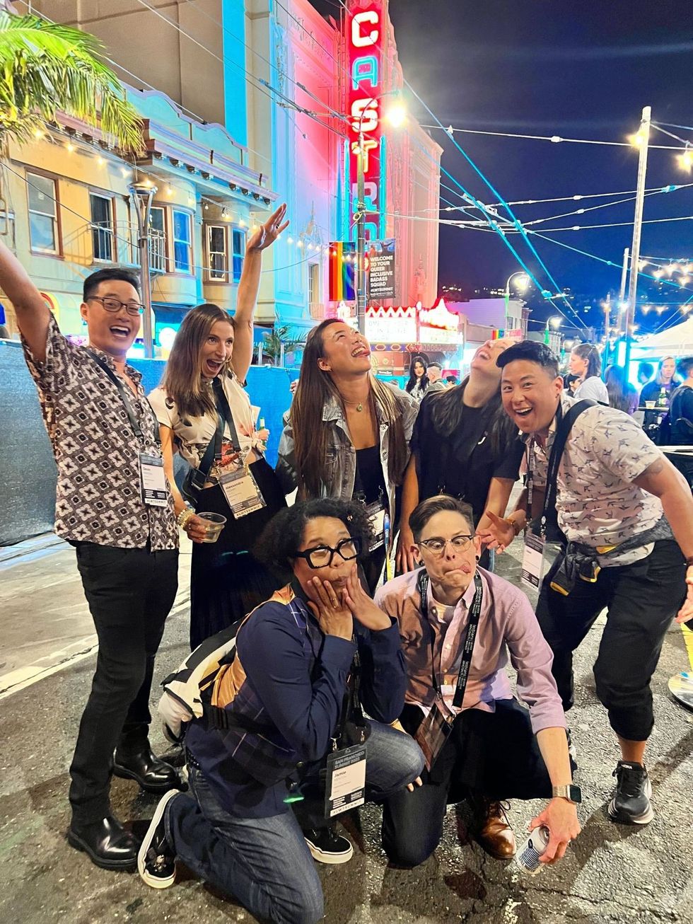 Various Udemy team members making silly/ funny faces at a Pride event