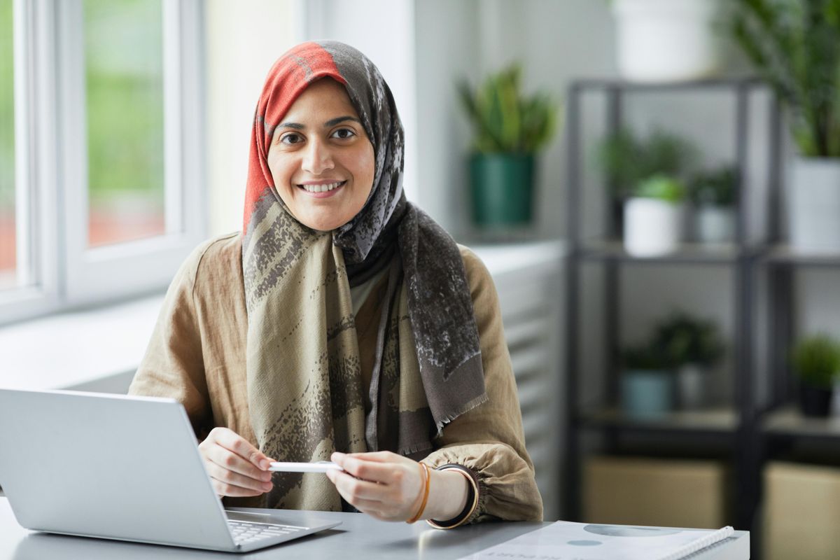 Woman at laptop smiling