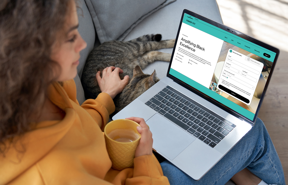 Woman on PowerToFly website with cat beside her