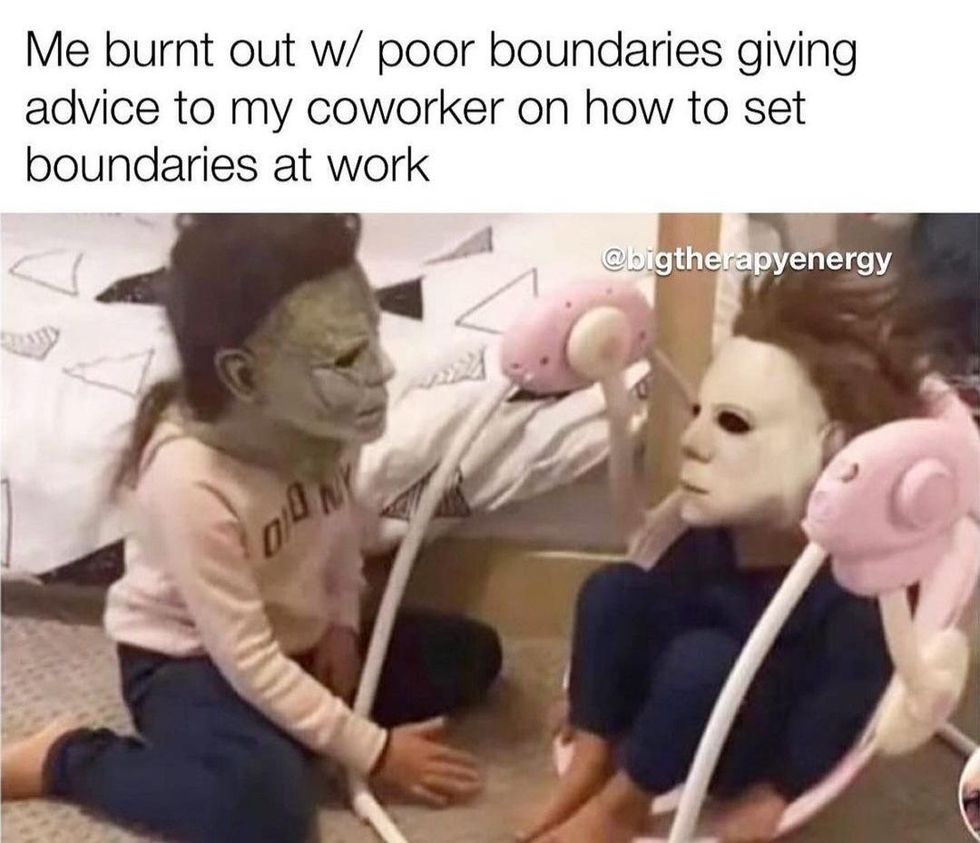work from home meme featuring two kids with scary masks on staring at each other with caption saying, "me burnt out w/ poor boundaries giving advice to my coworker on how to set boundaries at work" credit @bigtherapyenergy